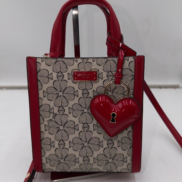 kate spade Handbags - kate spade Red and Beige Printed Crossbody Tote with Heart Charm